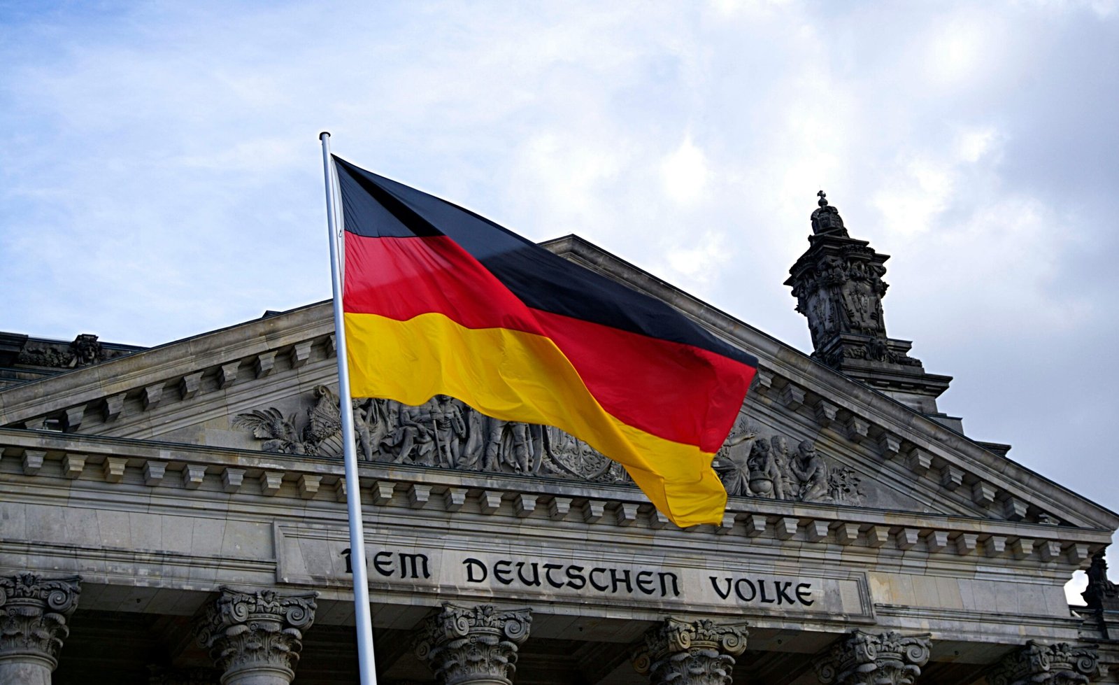 Germany is #3 on our best countries for expats with families. Featured is the German flag.