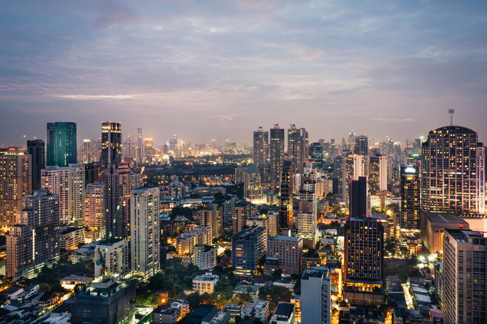 Thailand is #10 on our list of 'Best Countries for Americans to Move to'. Featured is downtown Bangkok, Thailand at night.