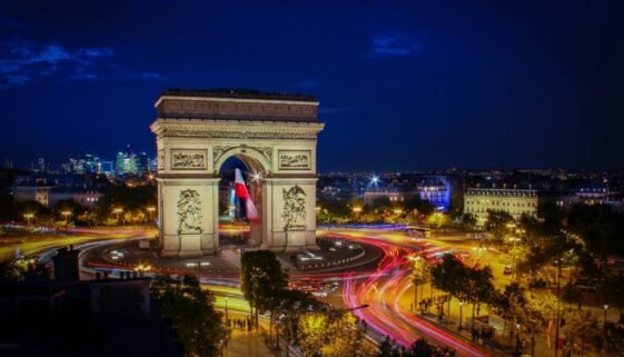 Arc de Triomphe beautifully lit up in Paris, France.