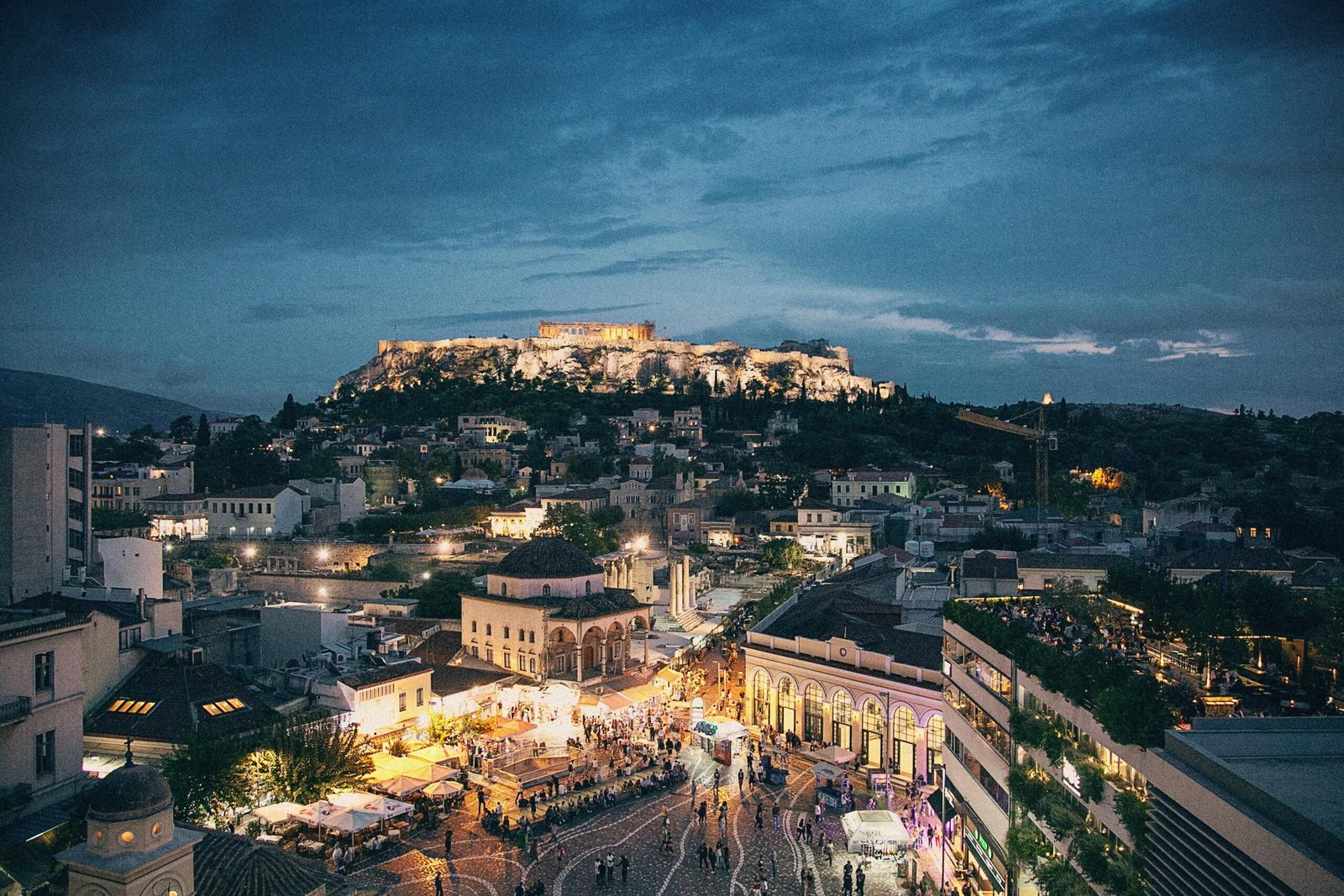 Discover the best things to do in Athens. Featured is Athens lit up at night.