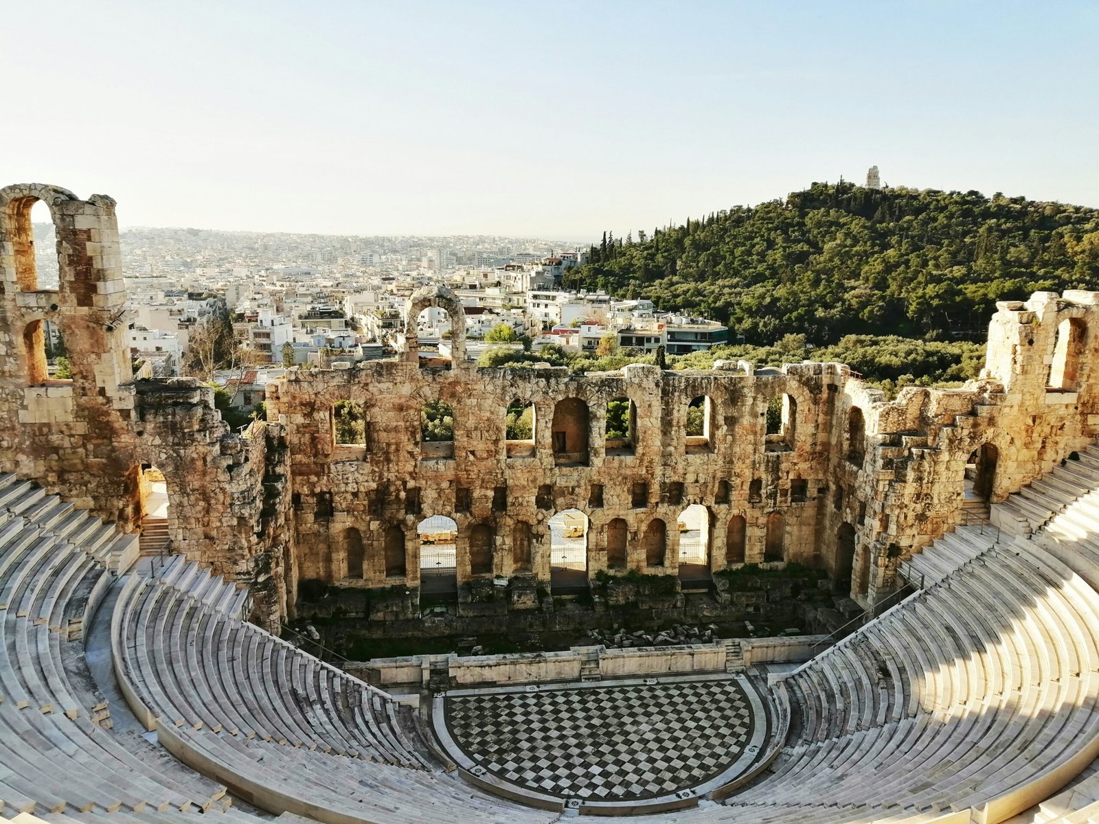 Discover the best things to do in Athens. Featured is an ancient amphitheater.