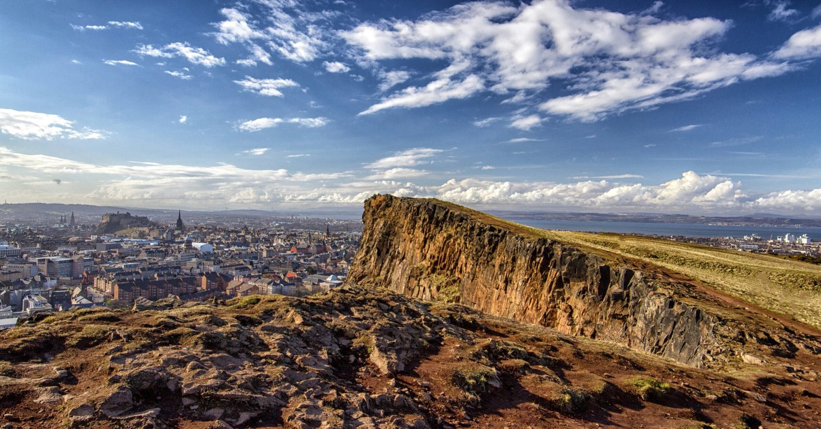 Edinburgh is #6 on our Europe travel bucket list. Featured is Arthur's Seat, a popular hiking spot that overlooks the city.