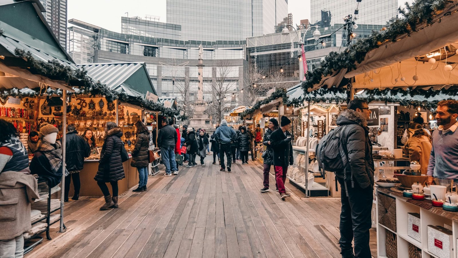 In this European Christmas markets guide learn the best food and drink to try. Featured is people enjoying the festivities of a Christmas market.