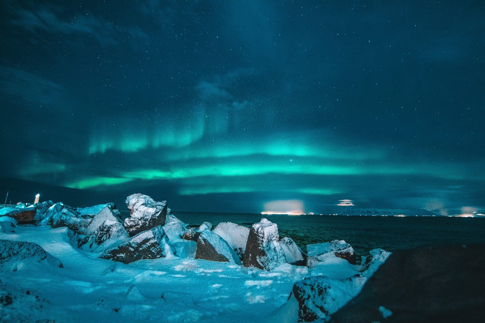 Iceland is one of the safest countries in the world to solo travel. Featured is a picture of the Northern Lights.