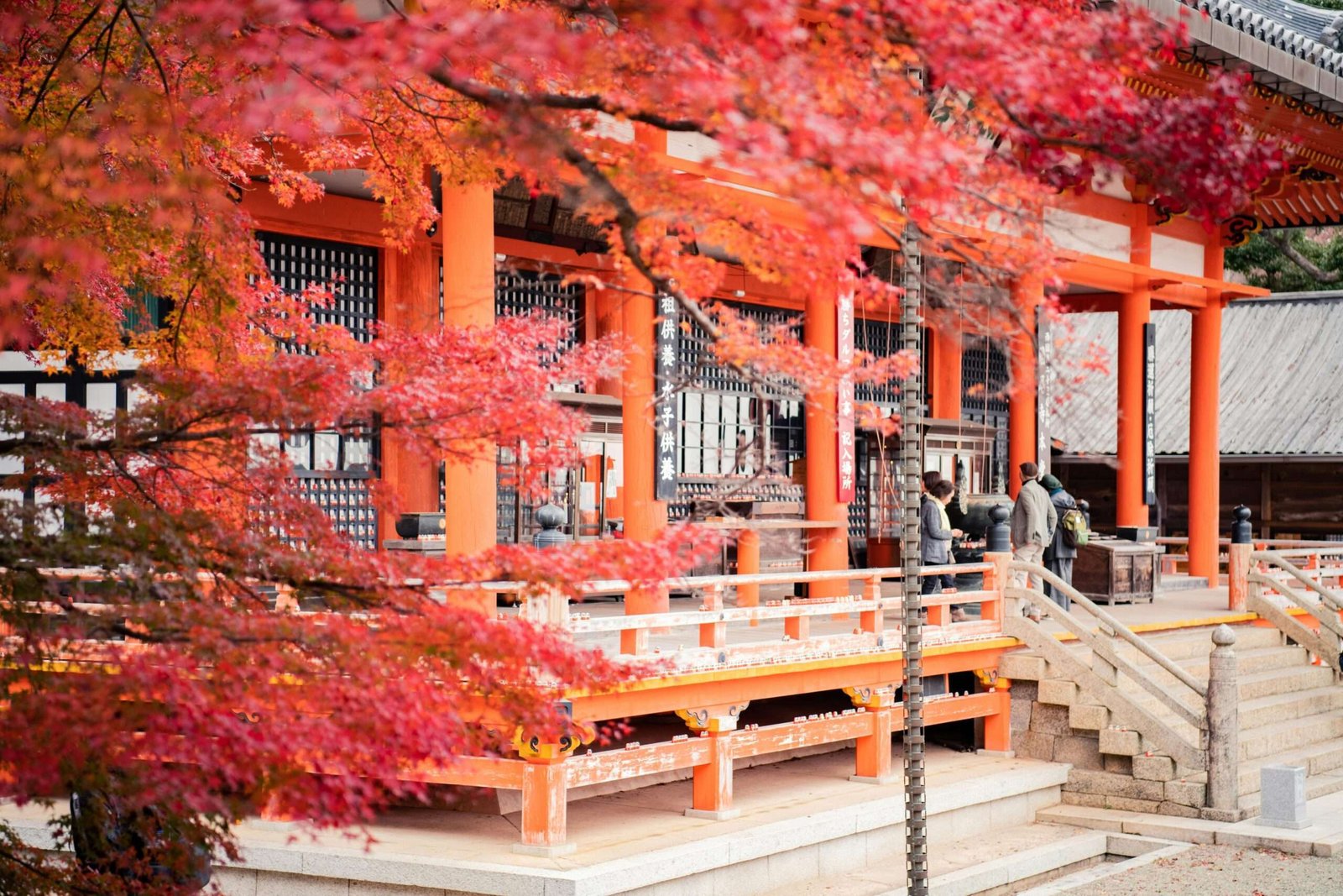 Japan is one of the best countries to travel to in October. Featured is a temple with beautiful fall foliage surrounding it.