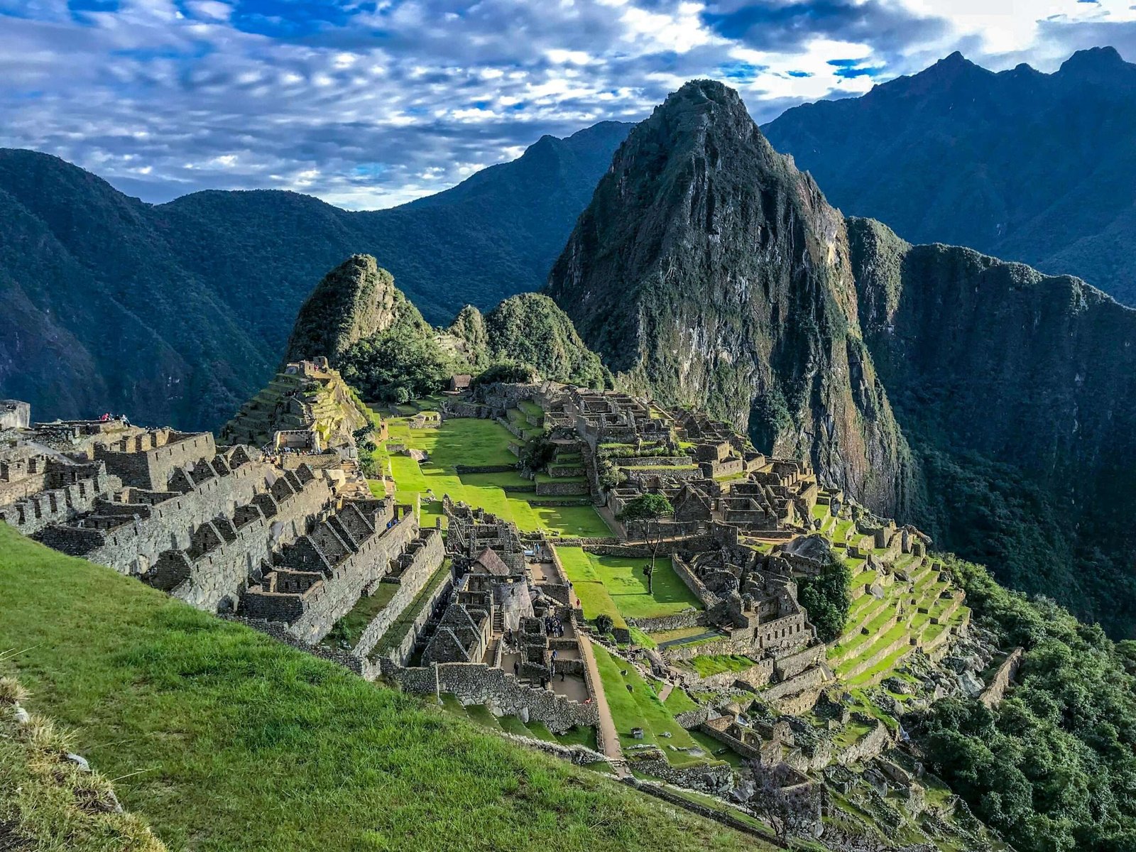 Peru is one of the best countries to travel to in October. Featured is Machu Picchu.