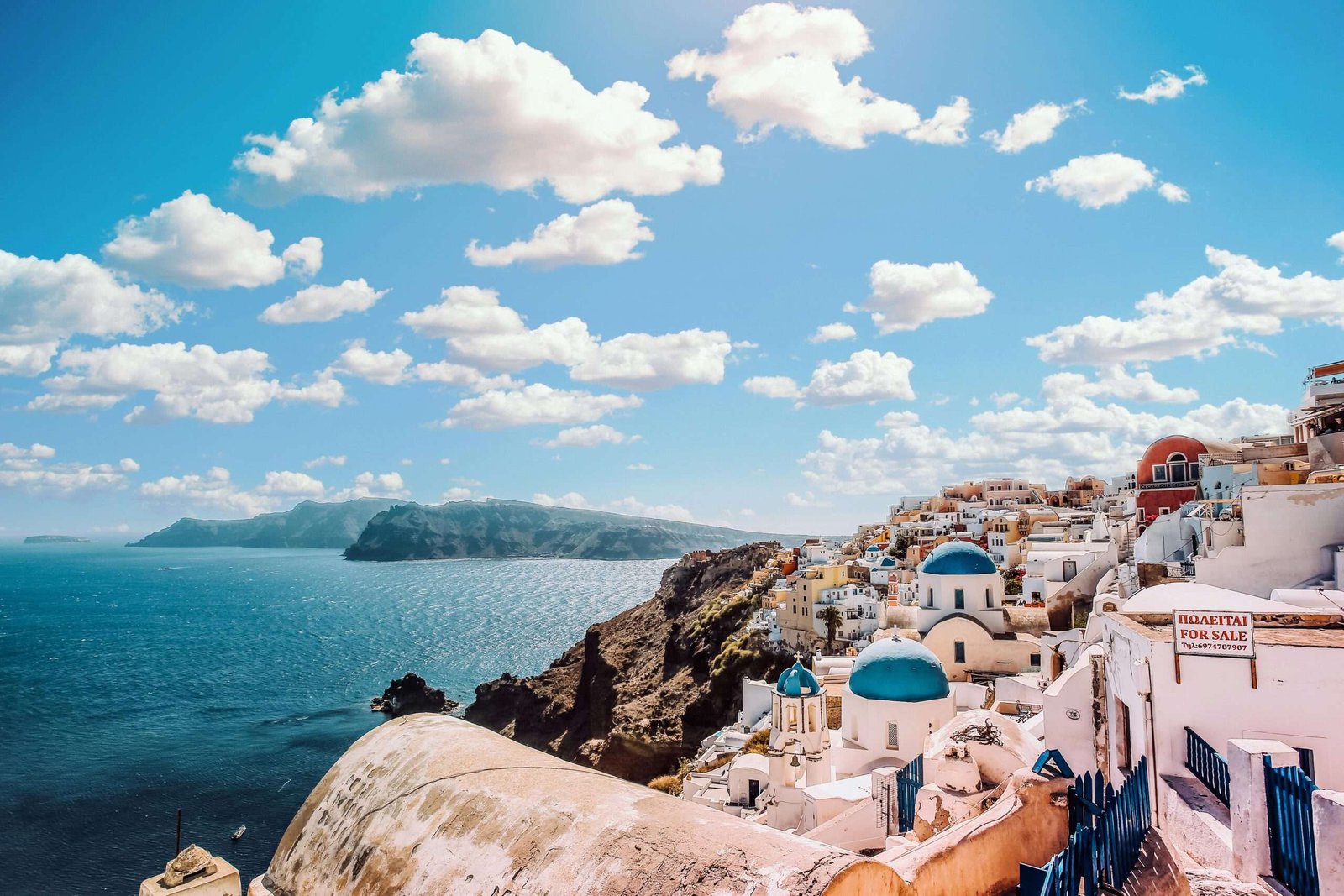 Santorini is one of the best honeymoon destinations on a budget. Featured is Santorini's incredible cityscape.