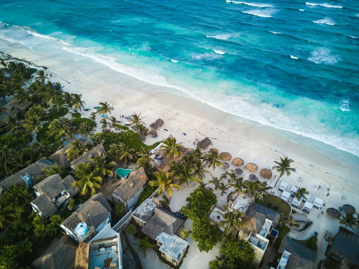 Mexico is one of the best places to travel for cheap. Featured is a gorgeous beach in Tulum, Mexico.