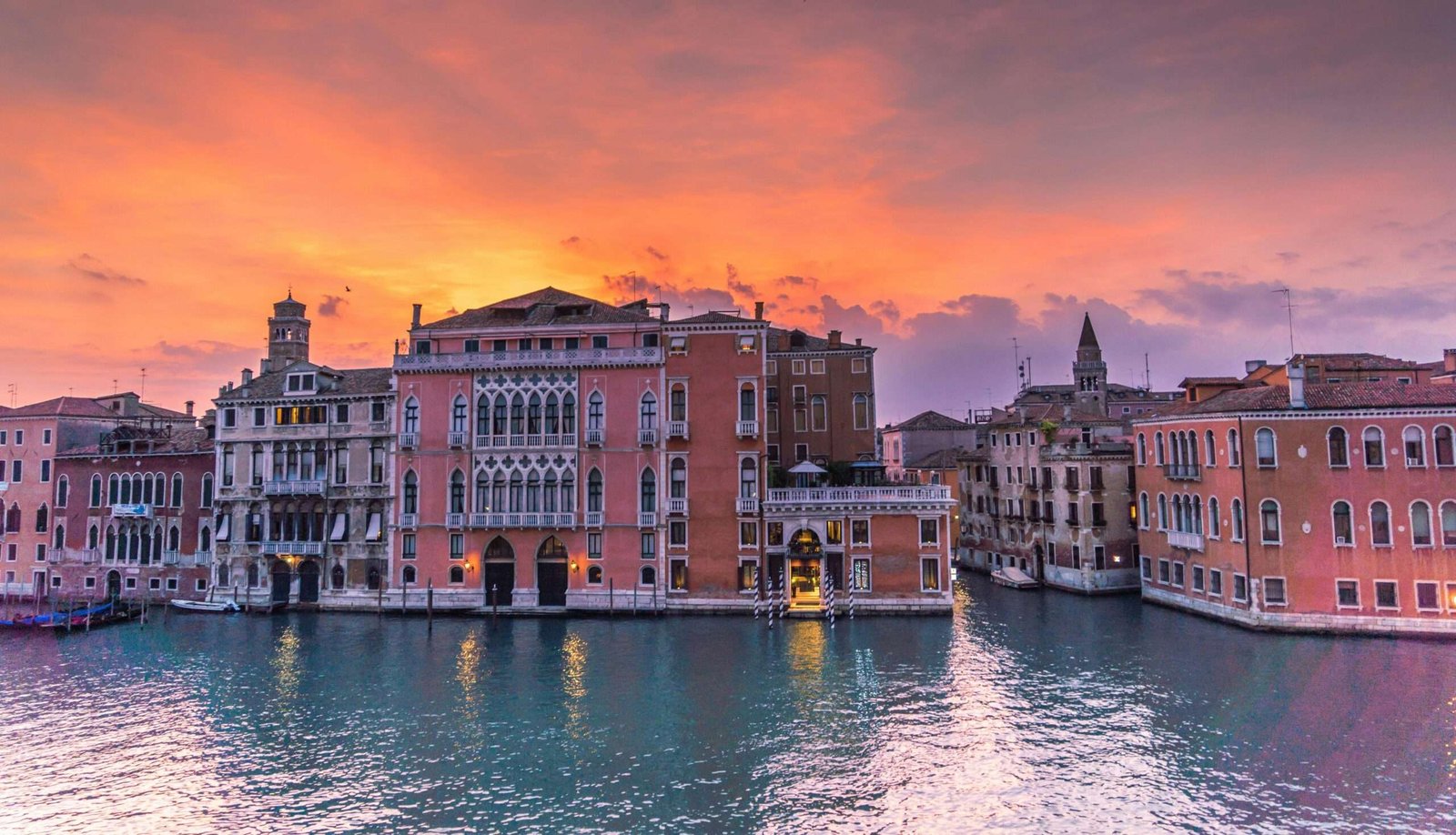 Discover the best things to do in Venice. Featured is Venice at sunset.