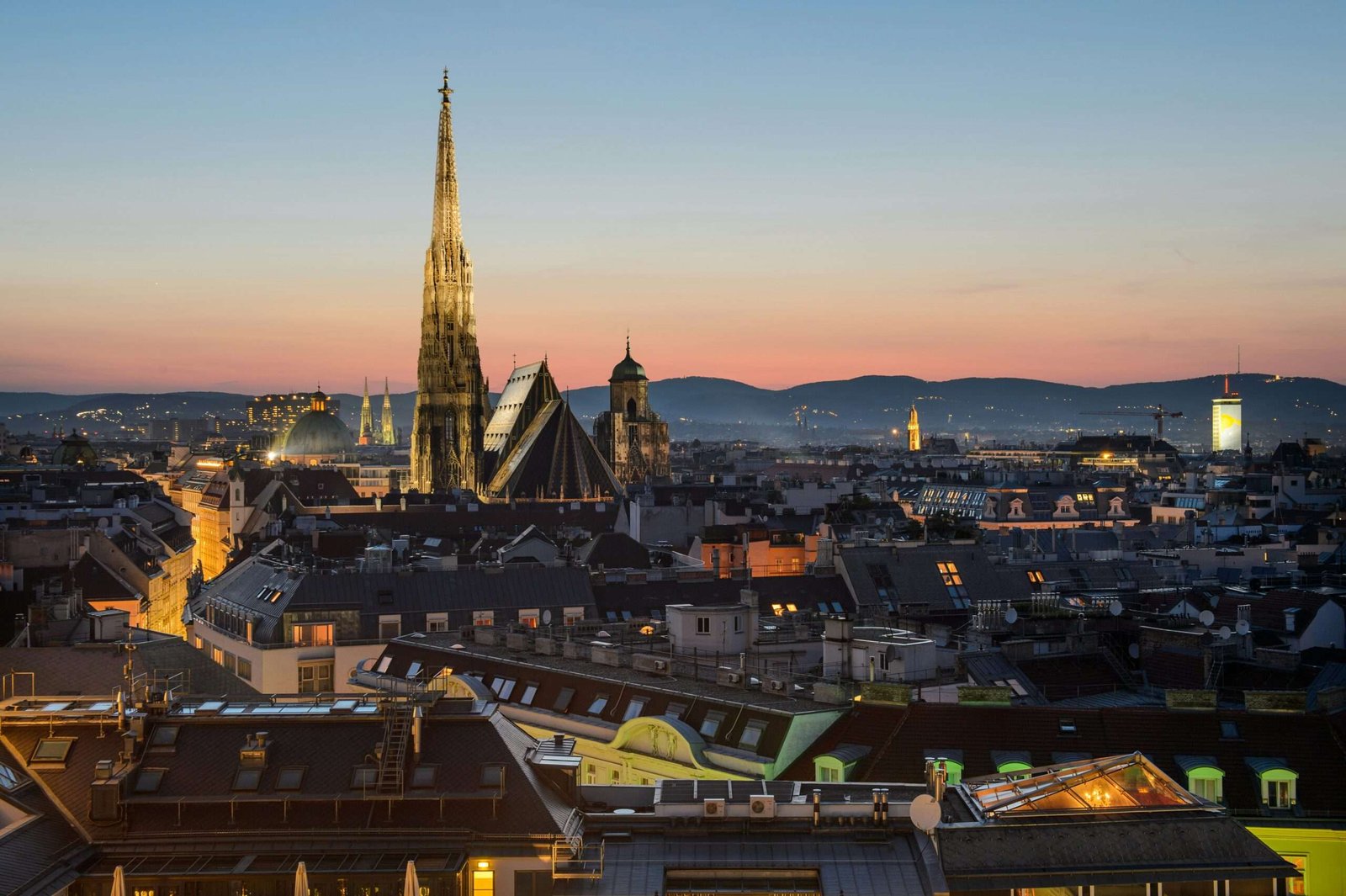 Vienna is #7 on our list of best European countries to visit. Featured is Vienna lit up at night..