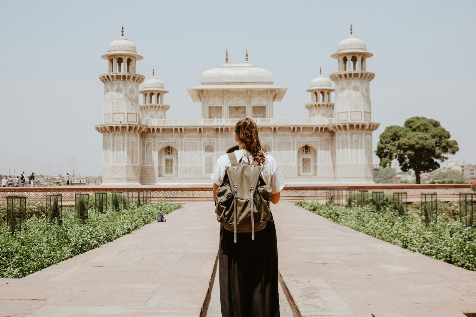 Explore the solo travel safety tips for women in their 30s. Featured is a solo traveler in front of a landmark.