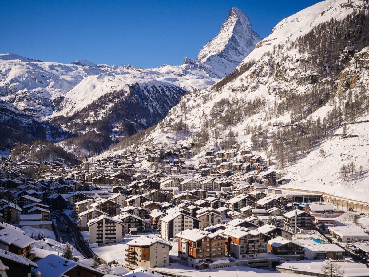 Zermatt is one of the best travel destinations for winter 2024. Featured is the gorgeous snowy town.