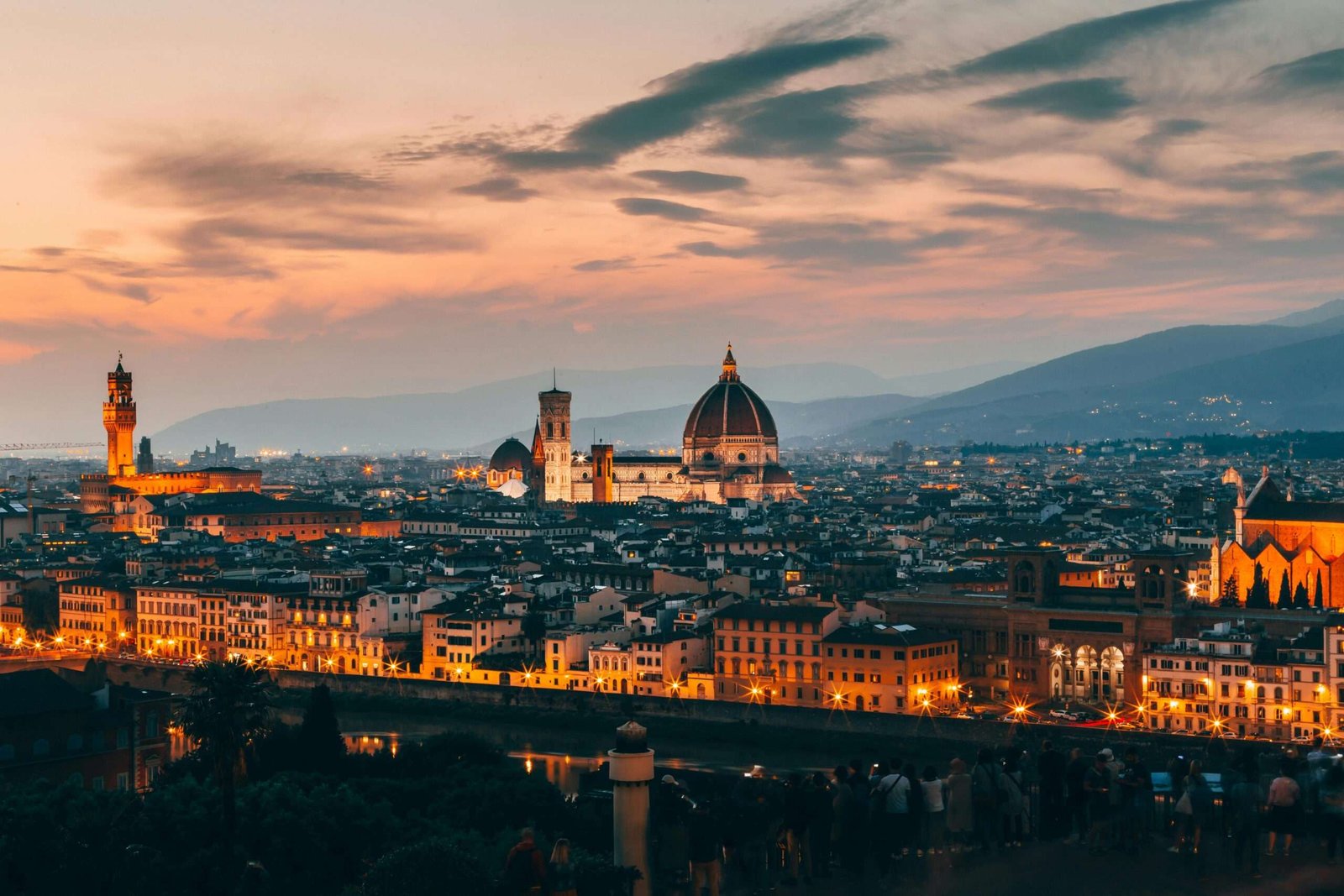 Explore the best things to do in Florence, Italy with this guide. Featured is an aerial view of Florence in the evening.