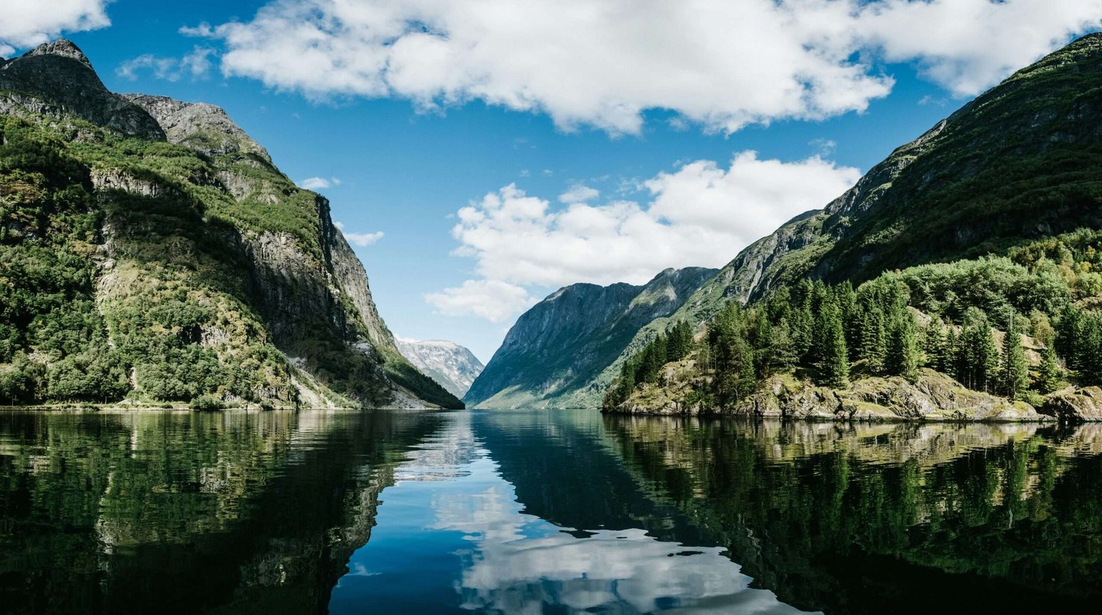 Norway is one of the best countries to visit in July. Featured is one of Norway's beautiful fjords.