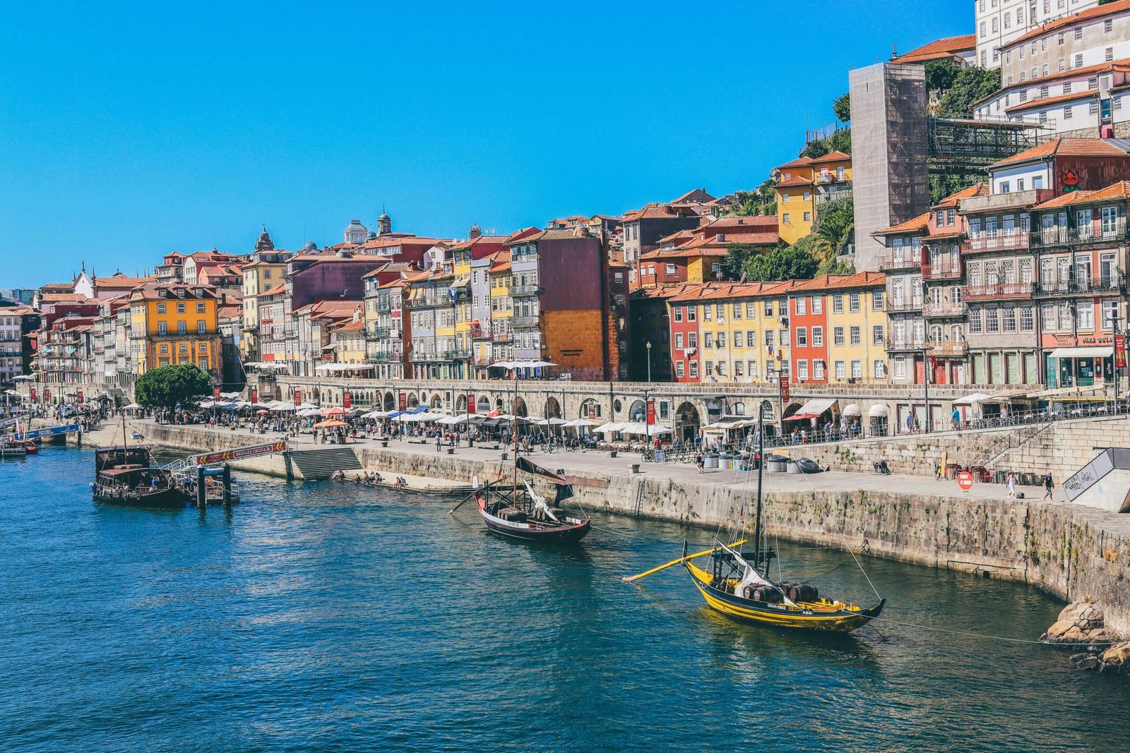 Portugal is one of the best places to travel for cheap. Featured is Porto, Portugal.